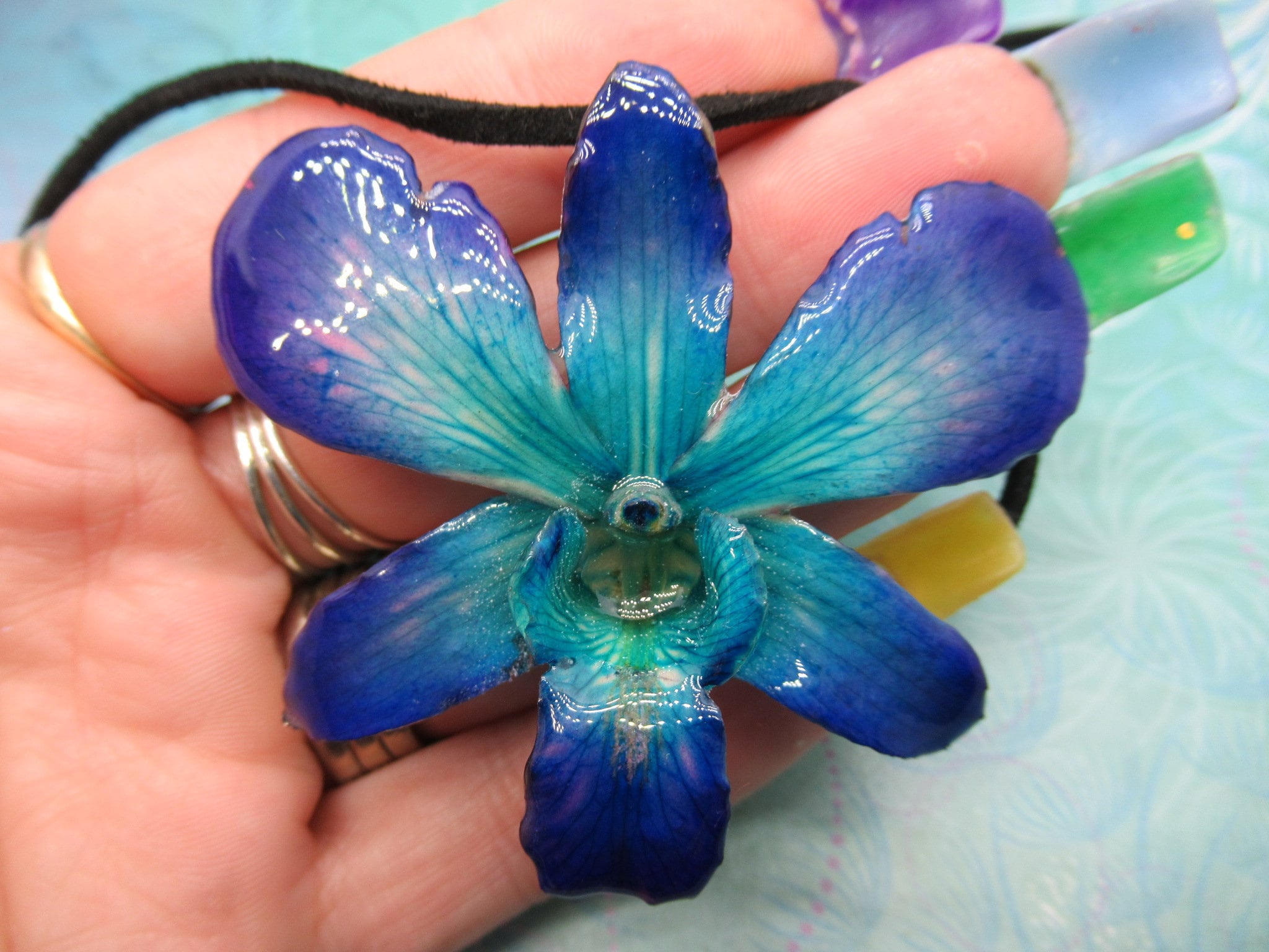Real Orchid Flower Necklace - Cyan/Blue/Purple. This is a REAL Orchid flower which has been preserved in resin making a unique necklace - Image 3