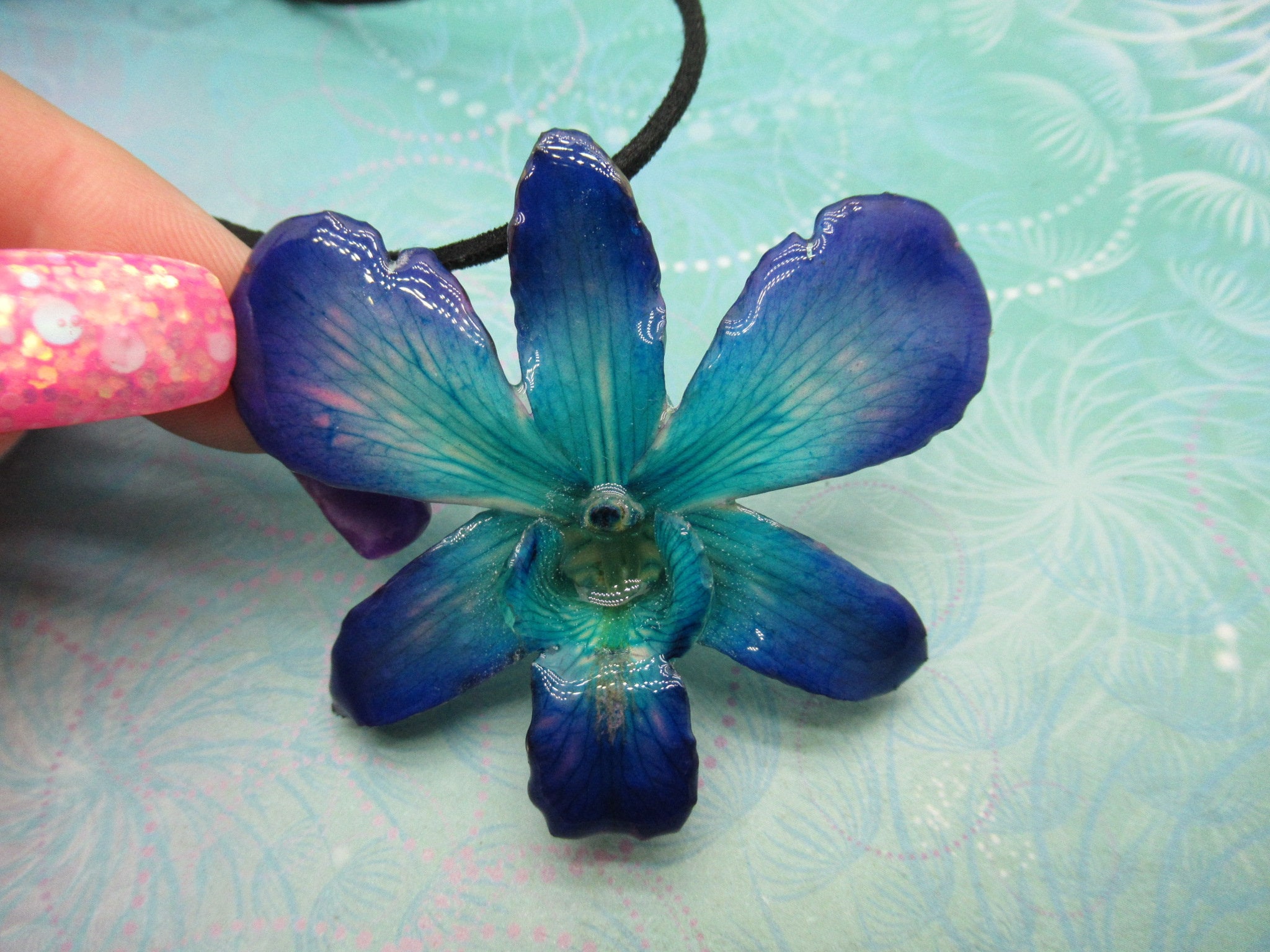 Real Orchid Flower Necklace - Cyan/Blue/Purple. This is a REAL Orchid flower which has been preserved in resin making a unique necklace - Image 2