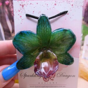Real Orchid Flower Necklace - Translucent Mermaid Green. This is a REAL Orchid flower preserved in resin, making a unique necklace