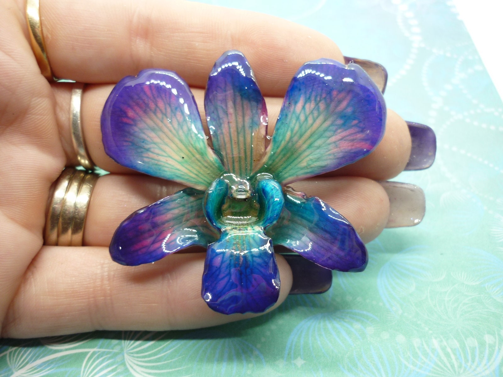 Real Orchid Flower Necklace - Cyan/Blue/Purple. This is a REAL Orchid flower which has been preserved in resin making a unique necklace