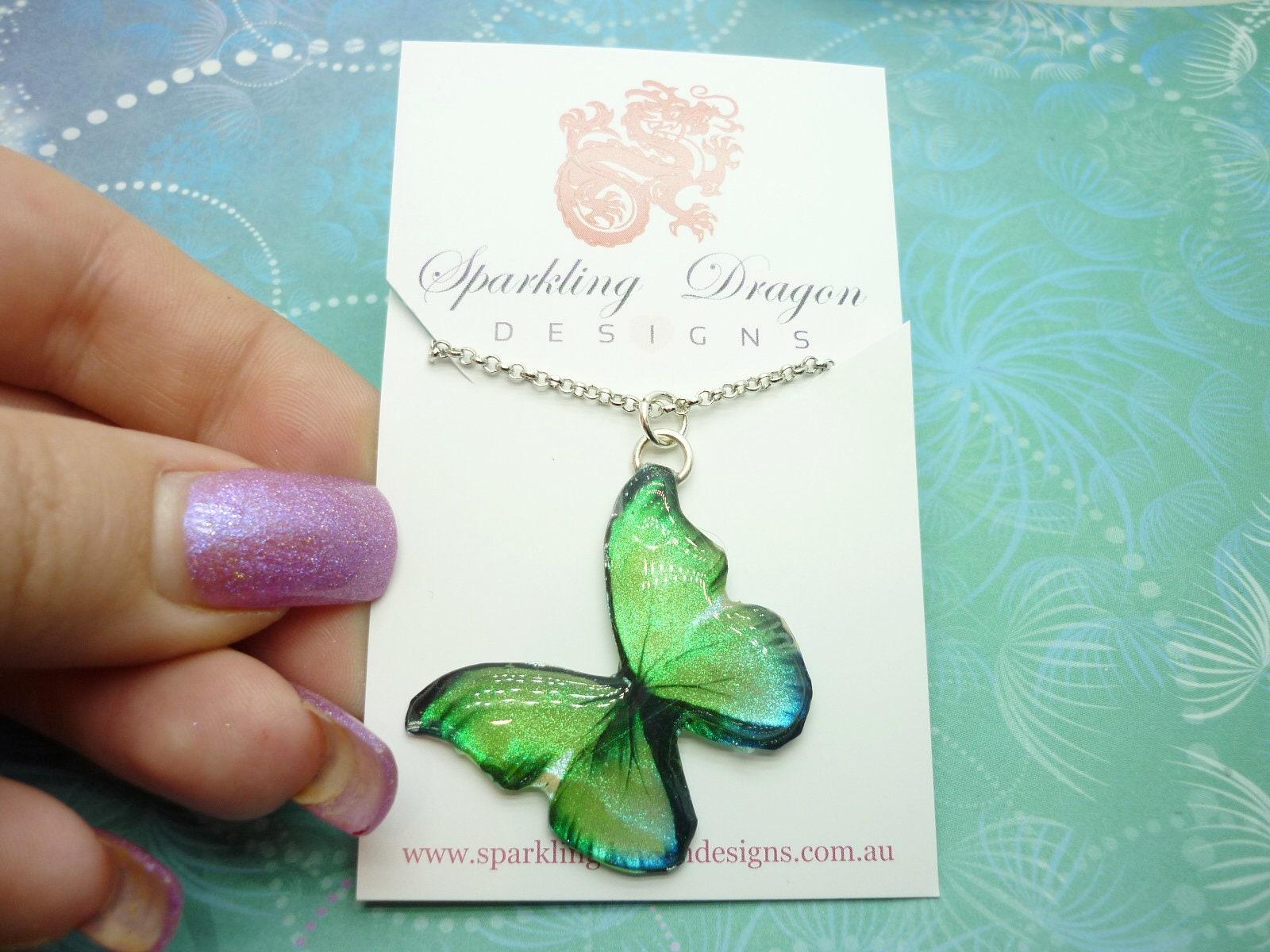 Butterfly necklace yellowy green, a little blue on sparkle silver plated chain - fairy jewellery, fun gift for her resin with glitter finish - Image 2