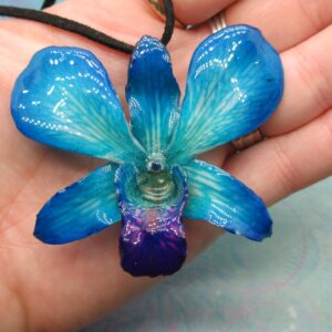 Real Orchid Flower Necklace - Teal/Cyan/Blue. This is a REAL Orchid flower which has been preserved in resin making a unique necklace